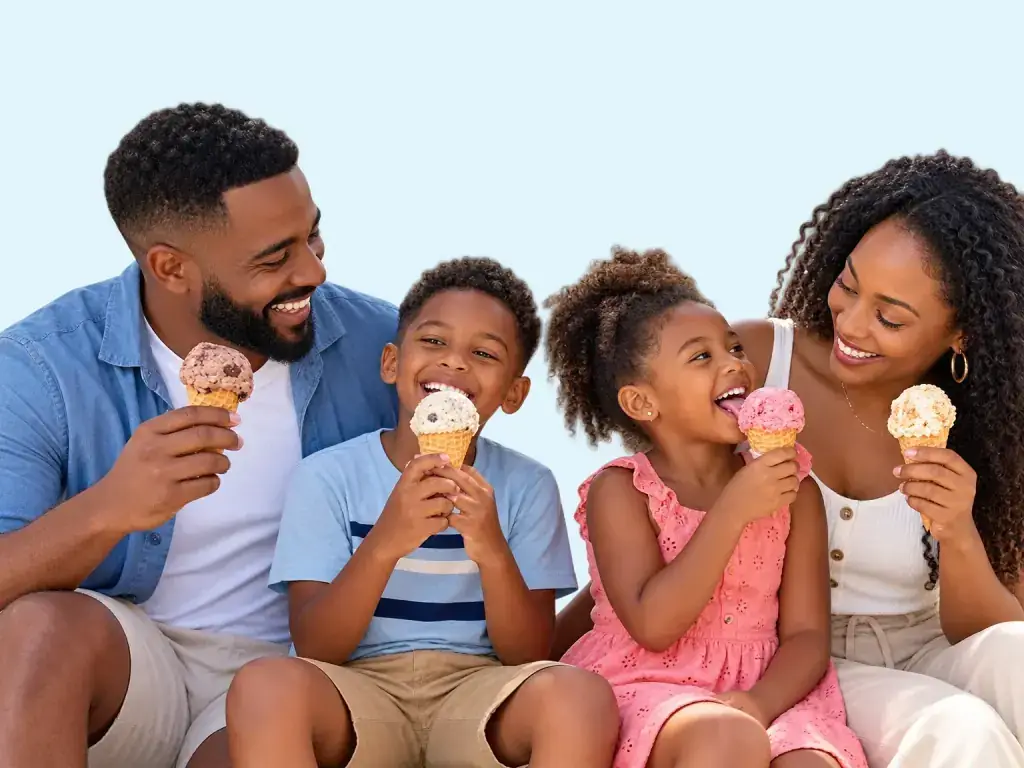 A Saint Lucian family of four laughing together as they eat Ferrands ice cream cones